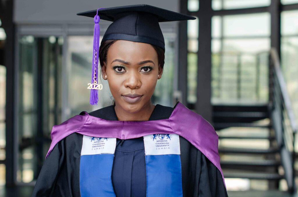 Portrait of a confident graduate at Cavendish University in Lusaka, Zambia.